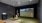 High-tech indoor golf simulator at The Shipwright apartments in Lynn, MA featuring a realistic course projection and TrackMan equipment